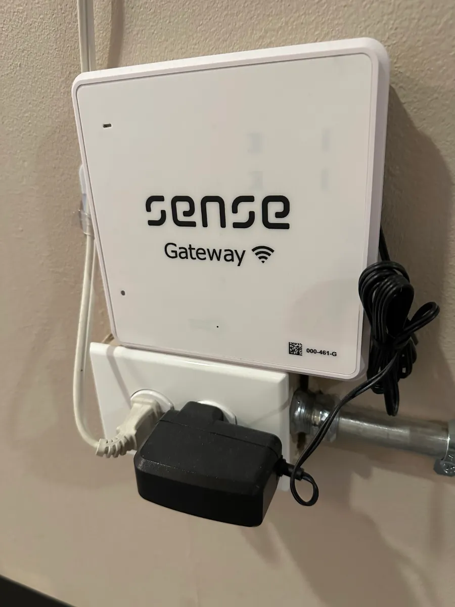 Sense Gateway RTLS device plugged in and mounted on a wall at the Developmental FX clinic